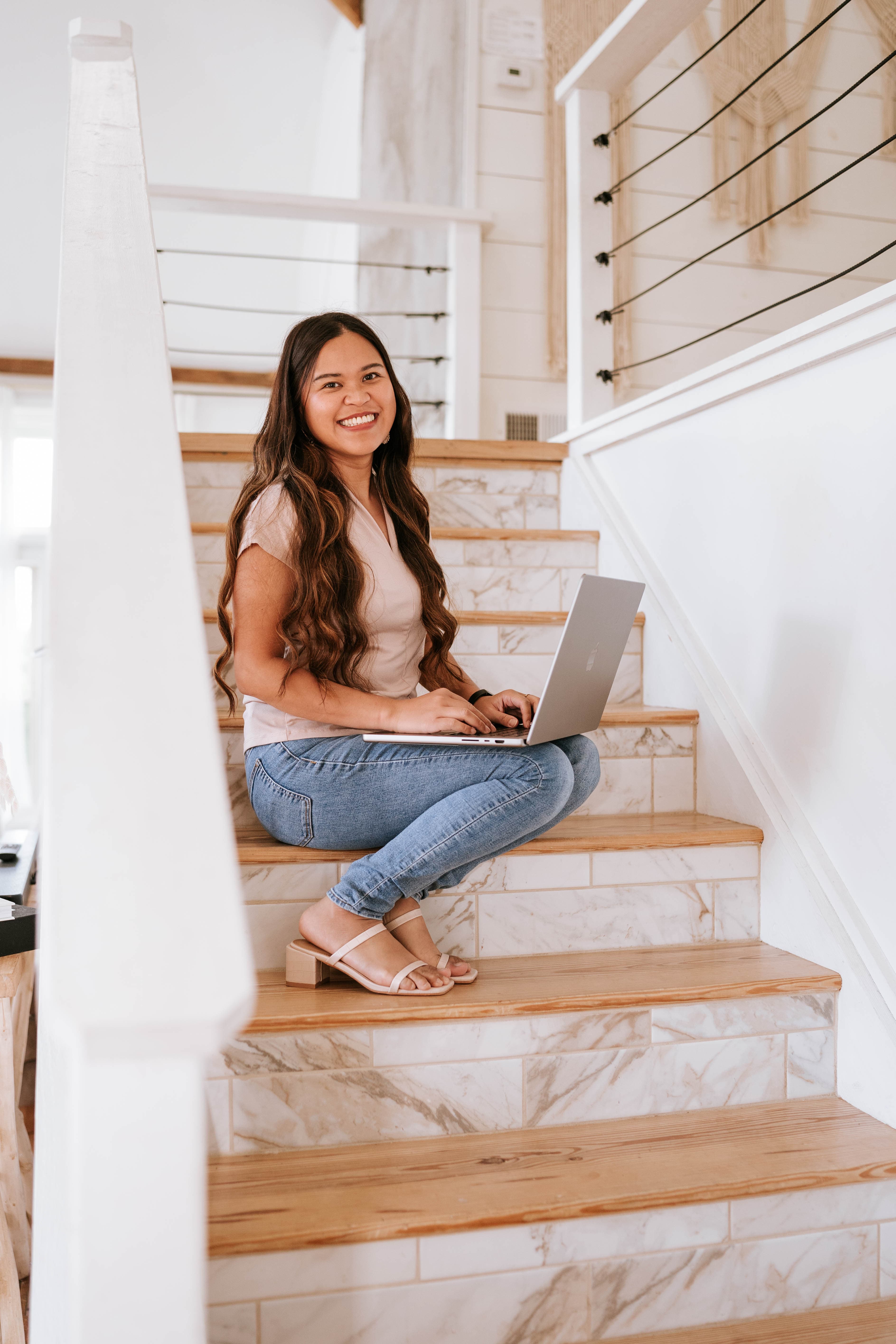 Kristy Yoder working from the stairs at home