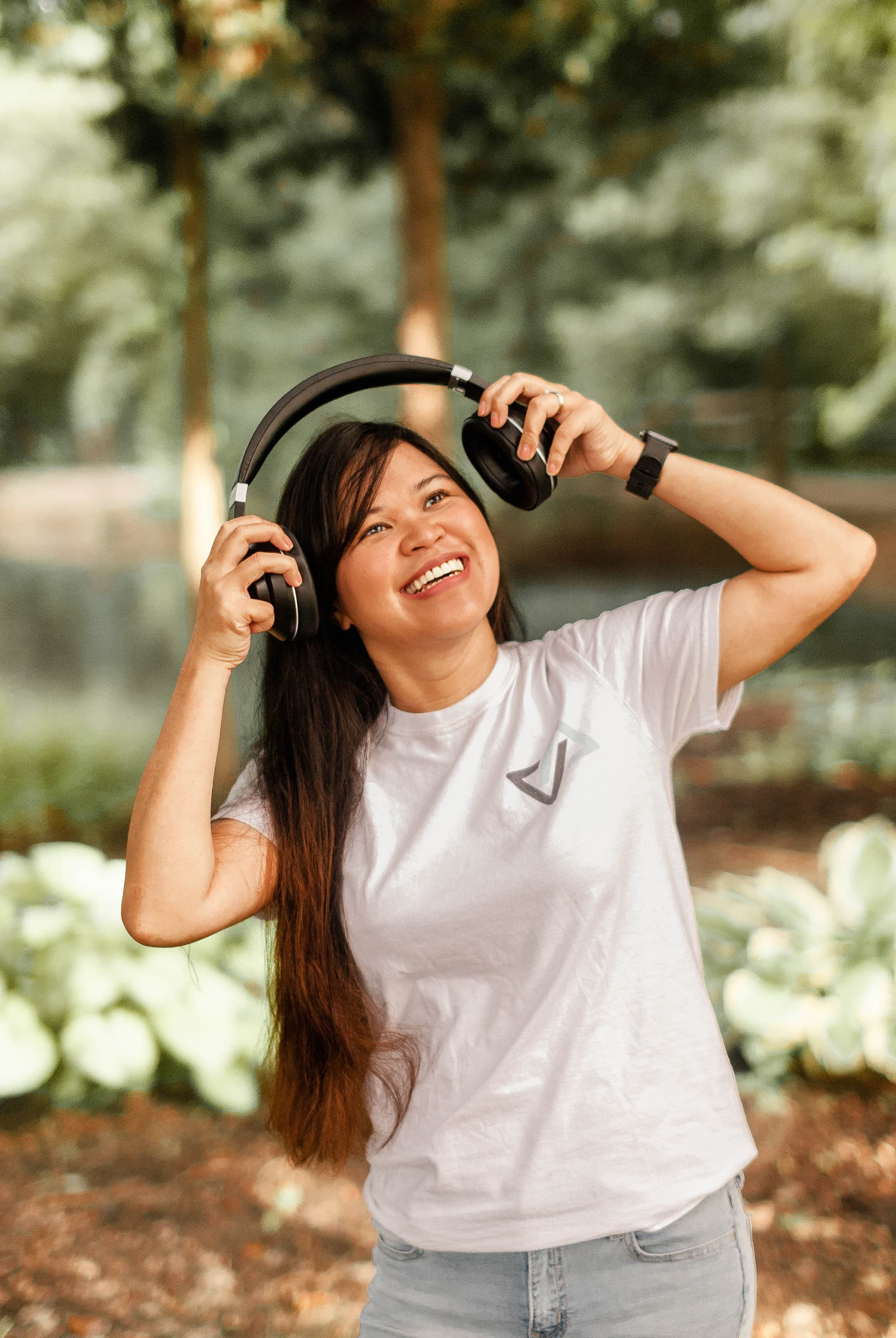 Kristy Yoder listening with headphones outdoors